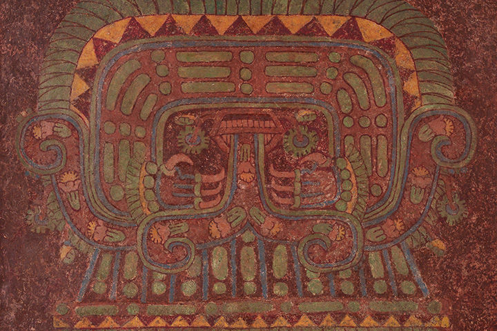 Wall painting from Teotihuacan, abstractly representing what may be a deity, in shades of red, green, orange, and blue.